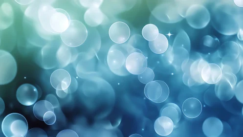 Defocused teal and blue bokeh field forms layered luminous circles