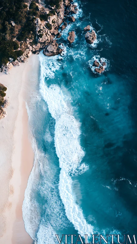 Aerial littoral interface with breaking waves and granite headland.