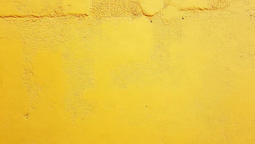 Sunlit yellow wall where texture and color quietly hum.