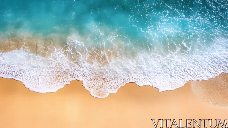 Overhead shoreline wave dynamics with foamy surf on smooth sand