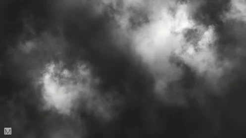 Ghostly storm clouds quietly carve windows of light