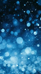 Blue defocused light particles with circular bokeh pattern.