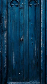 Midnight blue wooden door guarding quiet, half-told secrets.