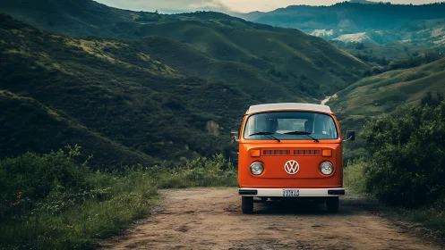 Vintage orange van parked on dirt road in green hills.