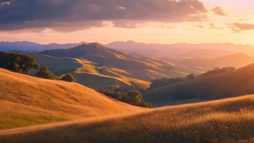 Golden sunset over rolling hills with distant mountain ridge.