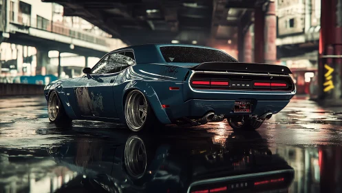 Modified blue muscle car in wet urban industrial setting.