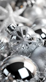 Glistening silver snowflake ornaments sparkle in soft light