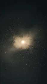 Soft moonlight glows through mist amid scattered stars.