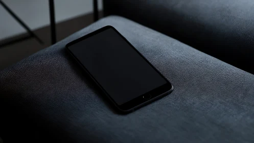 Smartphone Resting on Textured Upholstery