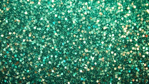 Emerald glitter texture with shimmering bokeh surface