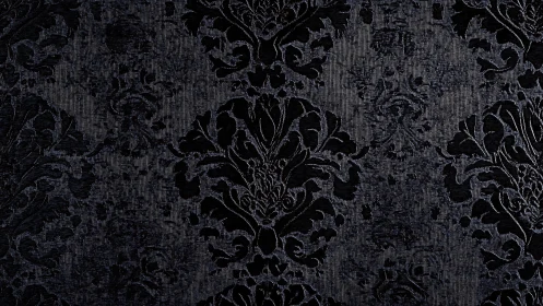 Dark damask textile shows repeating ornamental pattern