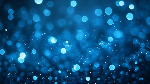Blue bokeh background with soft circular light spots.