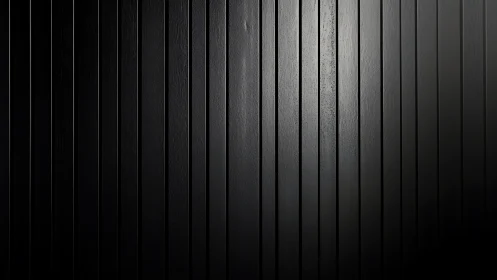 Black vertical wood wall shows subtle light gradient texture