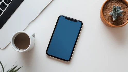 Digital Oasis: Phone, Coffee & Succulents Unite.