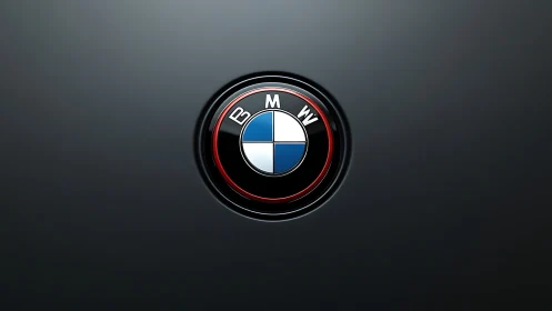 BMW roundel emblem on dark gradient automotive surface.