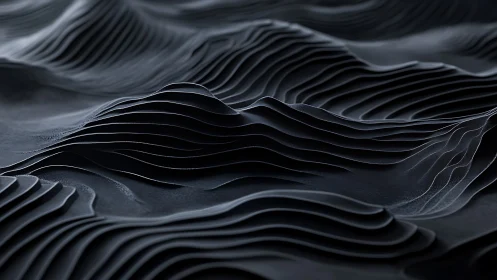 Layered graphite dunes forming abstract topographic waves.