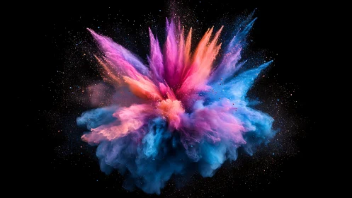 Colorful powder explosion burst on black background.