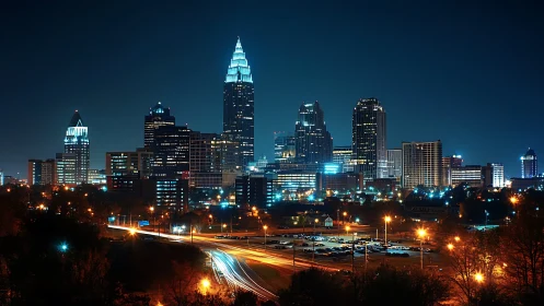 Modern skyscrapers glow over a vibrant city at night.