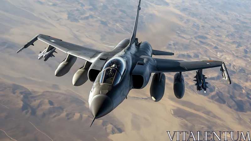 Tactical jet aircraft gliding over arid desert terrain.