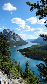 Sunlit mountain lake winding through a bright evergreen valley.