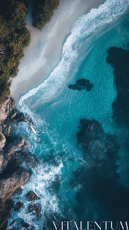 Aerial view captures turquoise surf along rugged rocky coast