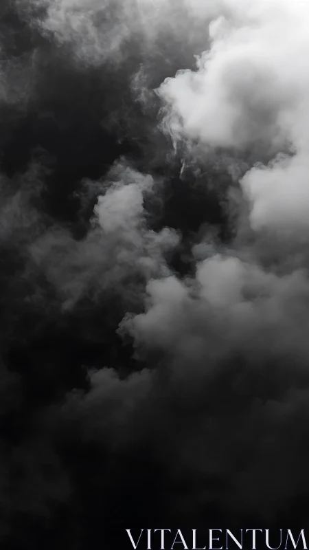Moody storm clouds drifting through a deep dark sky.