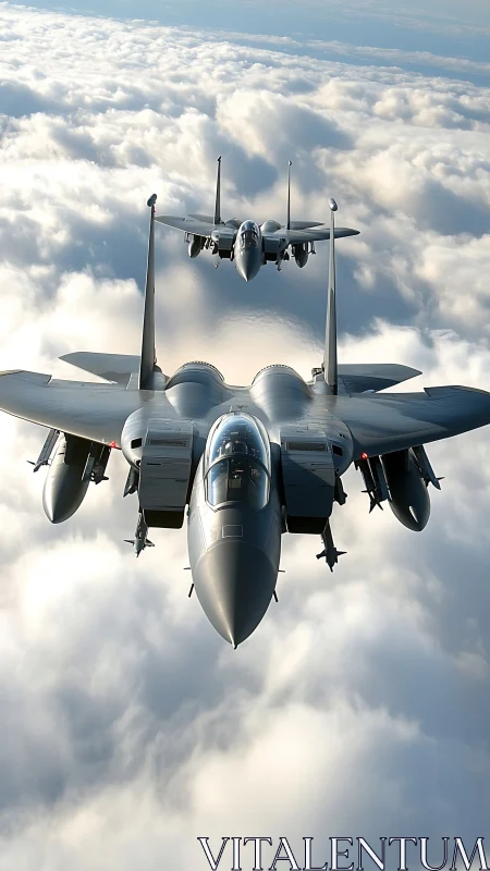 Twin fighter jets slice through sunlit clouds in formation.