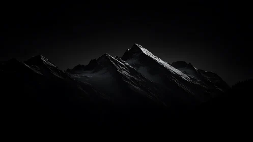 Moonlit ridge rising from ink-black mountain silence.