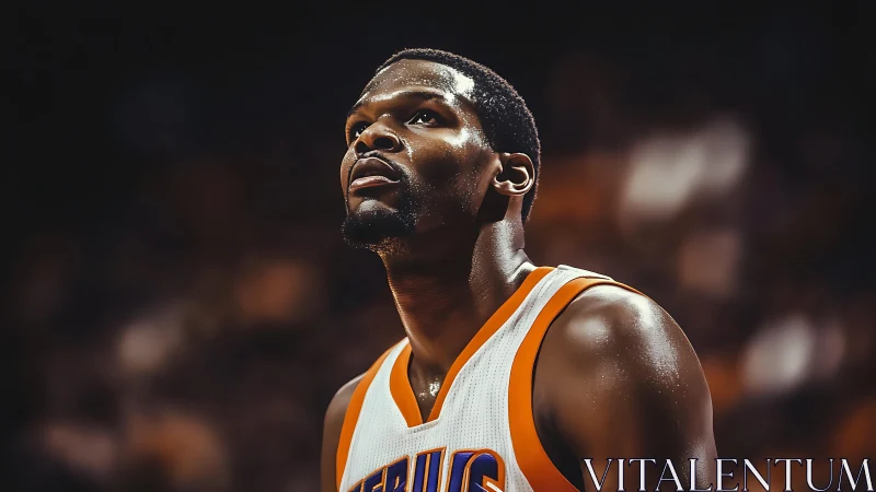Intense basketball portrait isolates athlete under arena lights