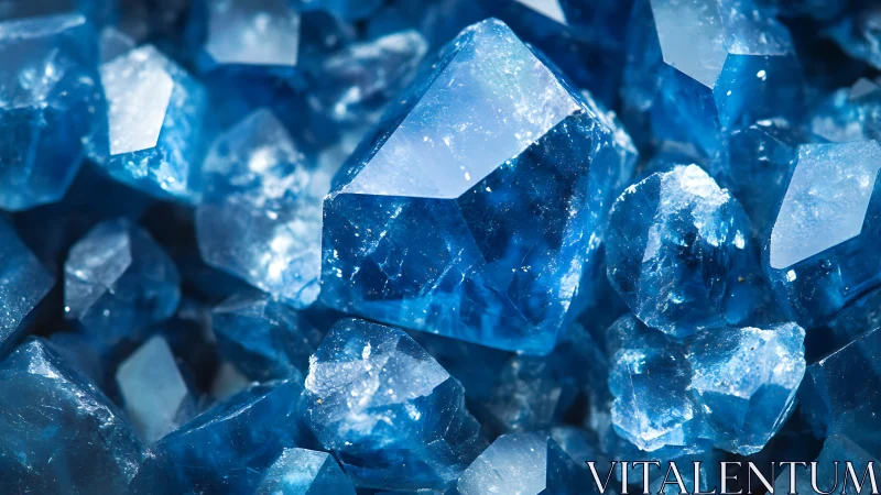 Deep blue crystal cluster with sharp geometric facets.