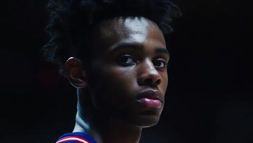 Basketball player portrait under dramatic low key lighting
