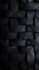 Textured black geometric weave with sculpted shadow planes.