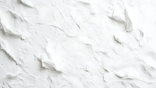 Textured white plaster surface shows layered ridges and folds