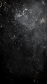 Abrasive dark wall texture reveals corroded industrial patina