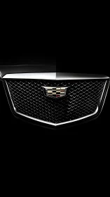 Chrome Cadillac grille presents bold geometric mesh design