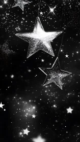 Silver glitter stars hang against dense night sky