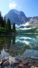 Snow-capped mountain mirrors in crystal alpine lake tranquility