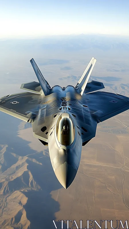 Stealth fighter jet banking over sunlit desert terrain.