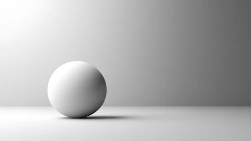 Monochrome matte sphere under soft directional studio lighting