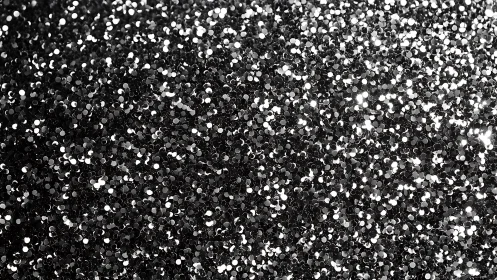 Shimmering silver glitter field in dense sparkling bokeh.