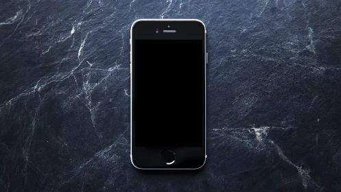 Minimalist smartphone specimen against dark crystalline surface texture.