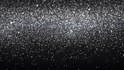 Monochrome glitter field dissolves into soft out-of-focus haze