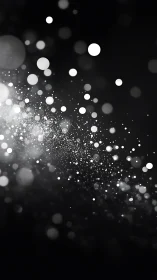 Monochrome light particle field on dark gradient background.