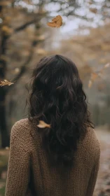 Quiet autumn walk with soft curls and drifting leaves.
