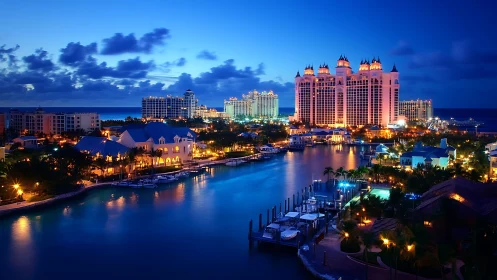 Lagoon-lit resort skyline glows under deep tropical twilight.