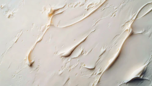 Creamy beige texture with thick smoothed streaks. Plain view.
