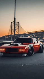 Sunset muscle machine prowls beneath glowing bridge lights.