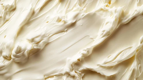 Close-up of creamy white butter texture in soft abstract style.