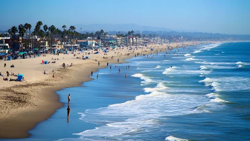 Coastal urban shoreline with receding surf and dense beachfront development.