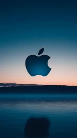 Apple Logo at Twilight: Minimalist Tech Against Serene Natural Landscape.